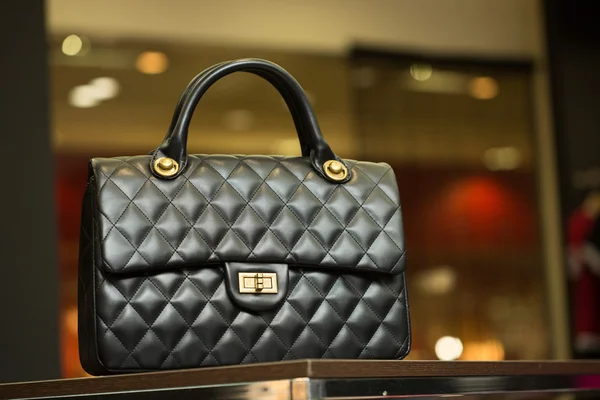 Black bag on a shelf in the store — Stock Photo, Image