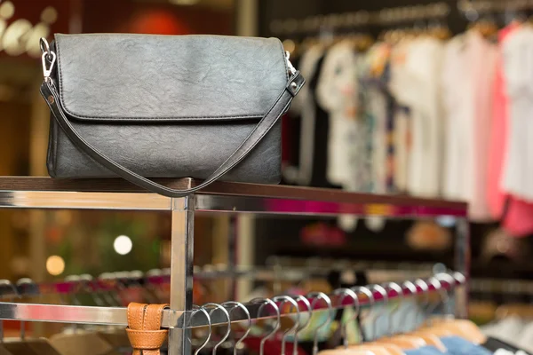 Black bag on a shelf in the store — Stock Photo, Image