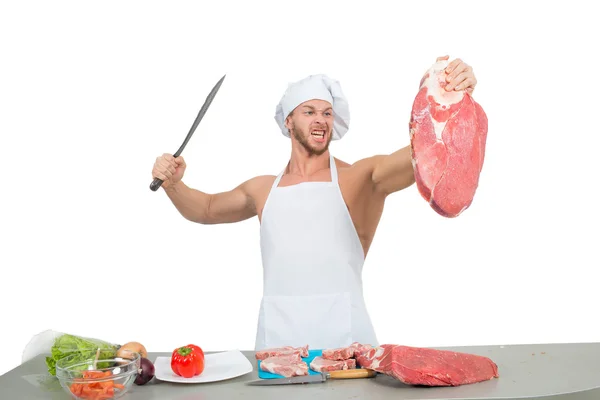 Chef Bodybuilder bereitet große Stücke rohes Fleisch zu. — Stockfoto