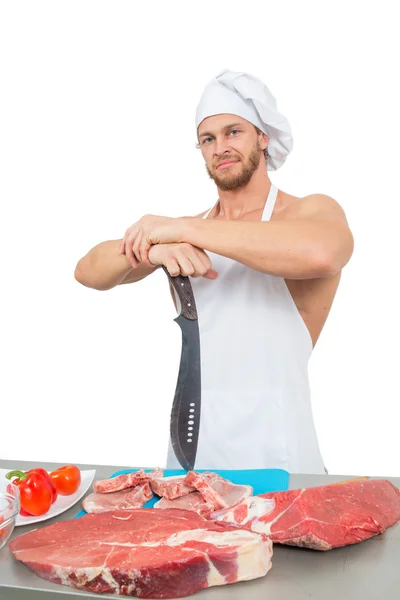 Chef bodybuilder preparing large chunks of raw meat. — Stock Photo, Image