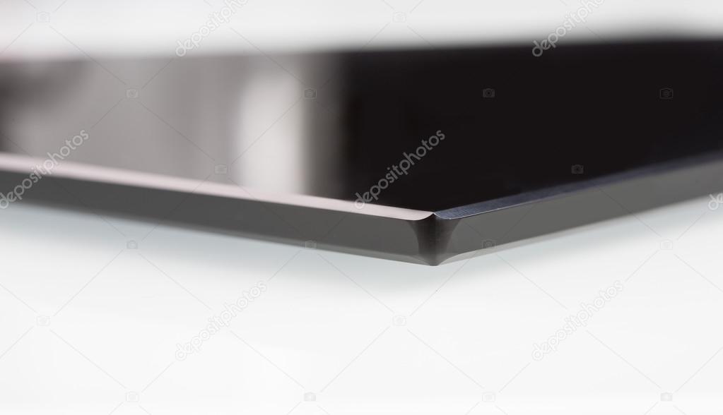 black sheet glass on a white. closeup
