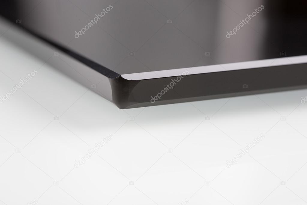 black sheet glass on a white. closeup
