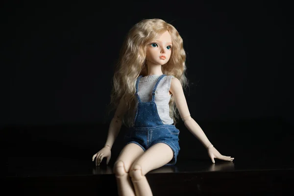 Doll on a light background. — Stock Photo, Image