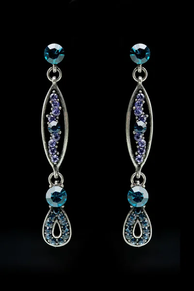 Earrings with blue stones on the black — Stock Photo, Image