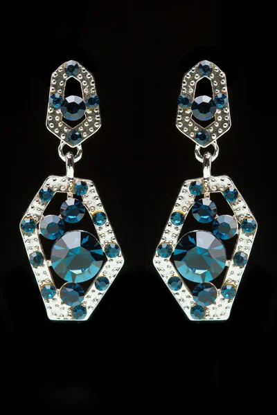 Earrings with blue stones on the black — Stock Photo, Image