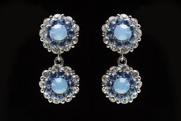 Earrings with blue stones on the black — Stock Photo, Image