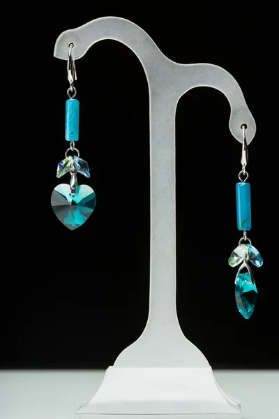 Earrings with blue stones on the black — Stock Photo, Image