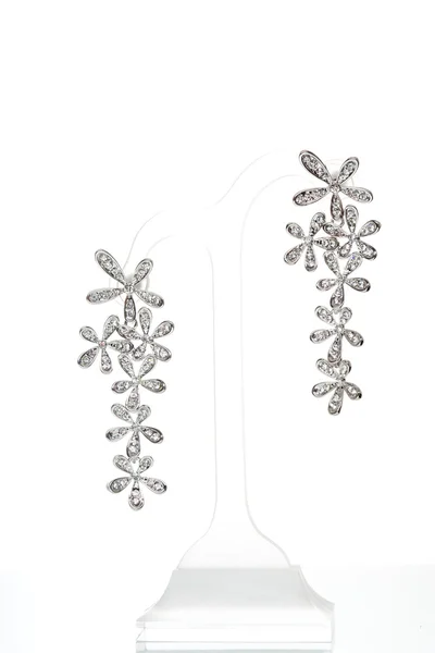 Earrings with Briliant on the white — Stock Photo, Image