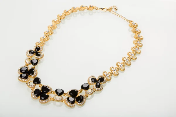 Necklace with black pearls on a white — Stock Photo, Image