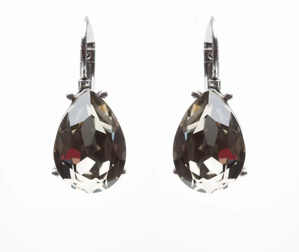 Earrings with black stones on the white — Stock Photo, Image