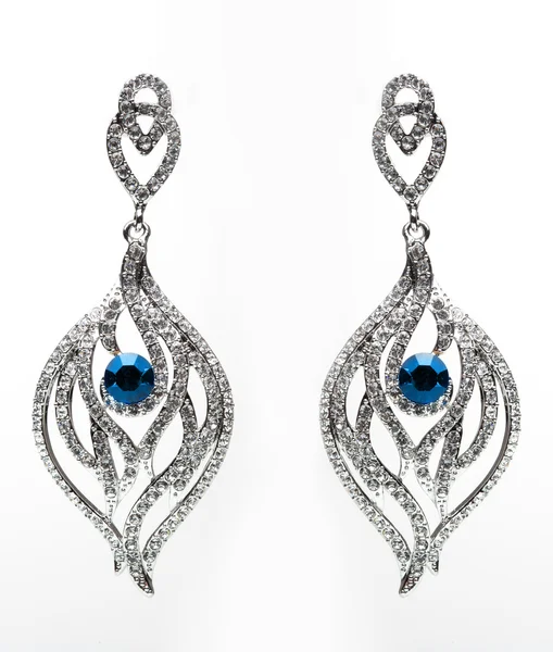 Earrings with blue stones on the white — Stock Photo, Image