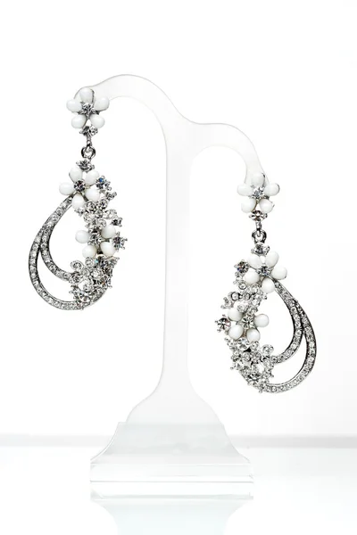 Earrings with Briliant on the white — Stock Photo, Image