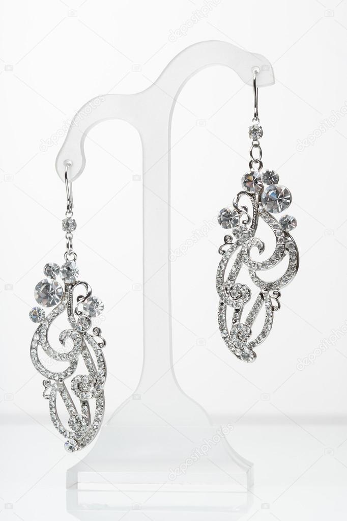 earrings with Briliant on the white