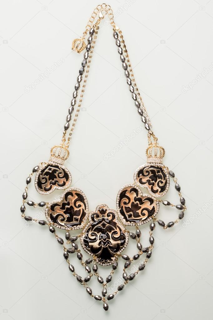 Necklace with black pearls on a white 