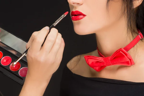 Lips of a girl with artist doing makeup — Stock Photo, Image