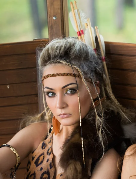 Beautiful amazon woman posing with bow — Stock Photo, Image