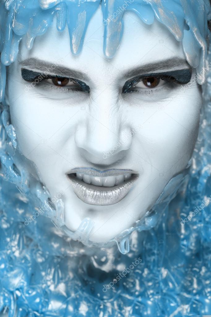 make-up of the ice. Close-up of beautiful angry girl