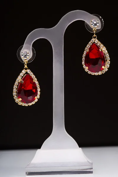 Earring with colorful red gems — Stock Photo, Image