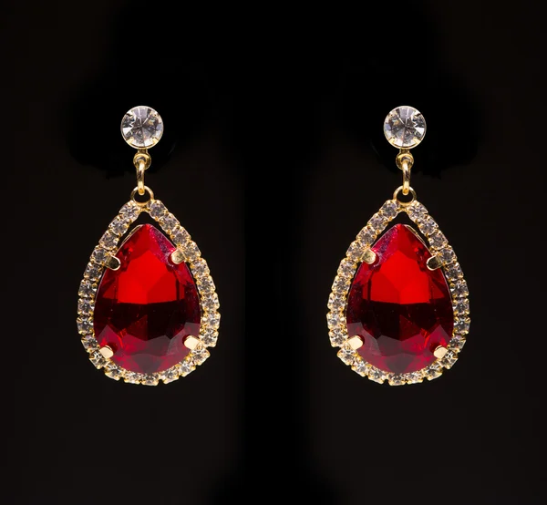 Earring with colorful red gems — Stock Photo, Image