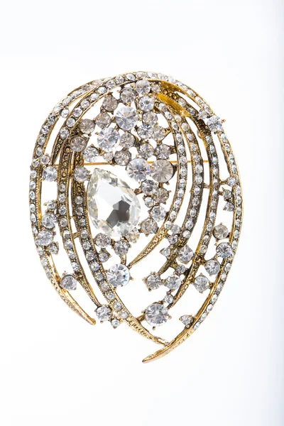 Round golden brooch with diamonds — Stock Photo, Image