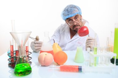 scientist fills chemicals fruit and vegetables clipart