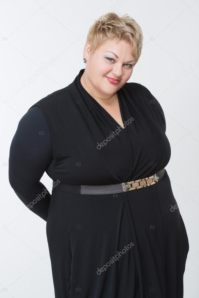 Smiling fat woman in black dress