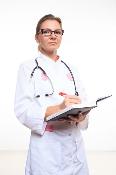 Portrait of a friendly female doctor with folder — Stock Photo, Image