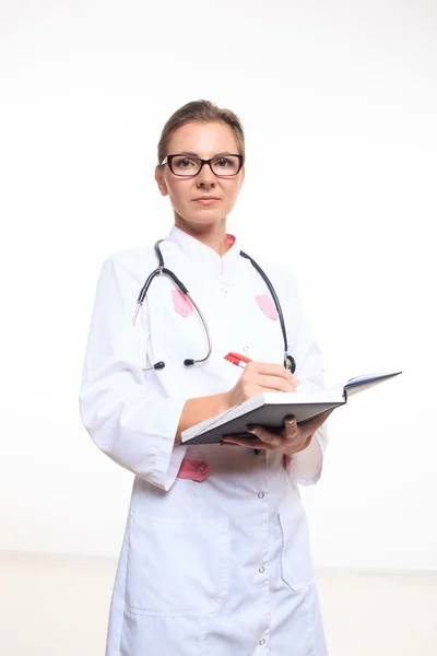 Portrait of a friendly female doctor with folder — Stock Photo, Image