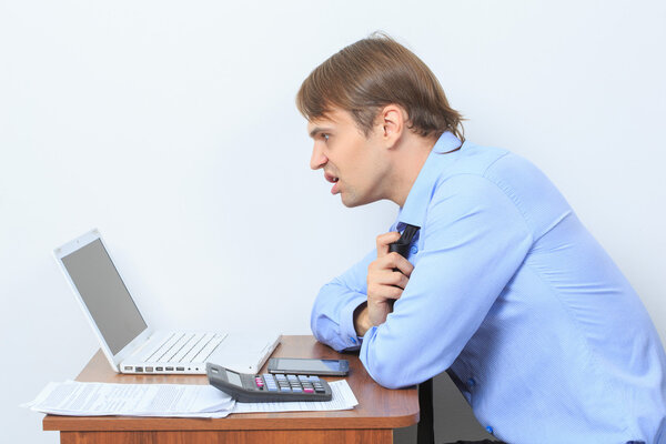 disgruntled manager at his desk.