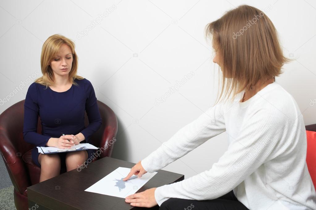 psychologist consulting pensive man during psychological therapy session