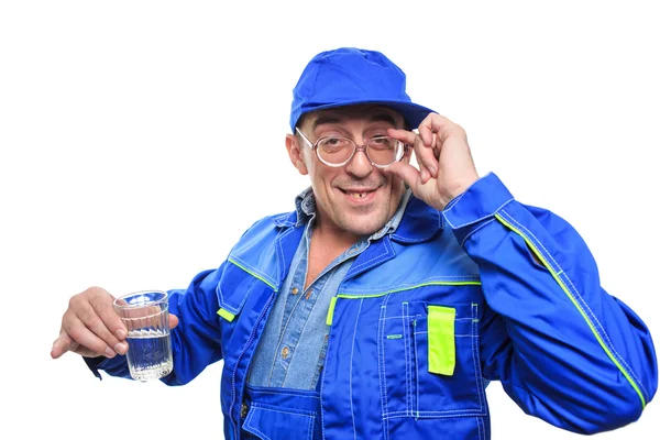 Adult drunk mechanic working with glass of alcohol. Royalty Free Stock Photos