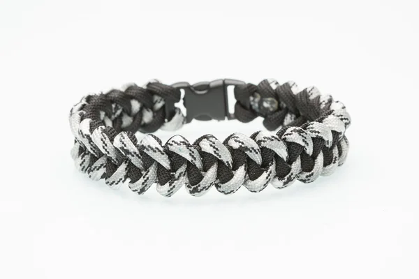 Black braided bracelet on white background — Stock Photo, Image