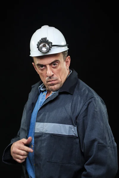 Man with Coal Miner Hat and Safety Clothing points finger — Stock Photo, Image