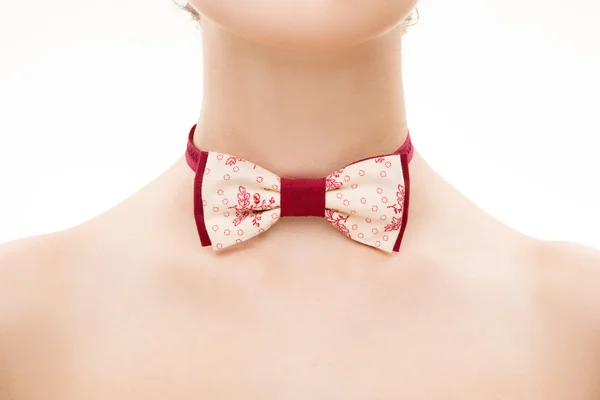 Vzorovaná kravata luk na ženský krk. — Stock fotografie
