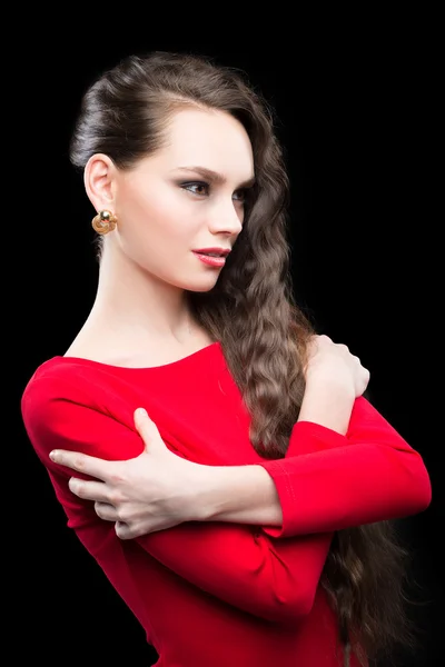 Beautiful woman with dark hair and evening makeup. sexy red dress — Stock Photo, Image