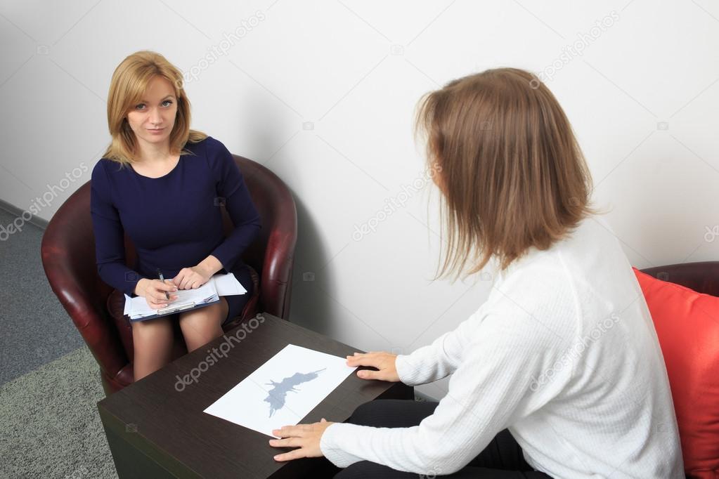 psychologist consulting pensive man during psychological therapy session