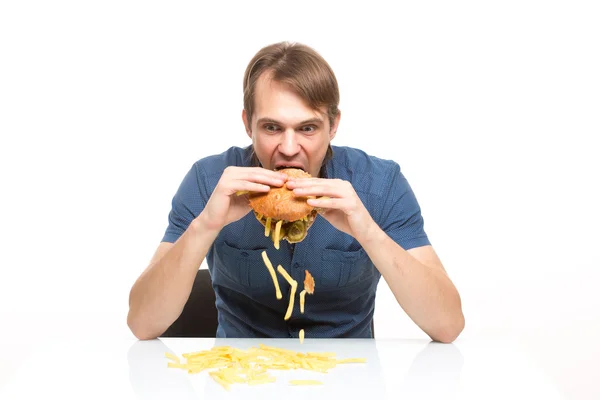 Man is not careful eating tasteless burger. — Stock Photo, Image