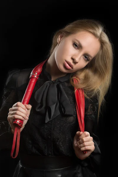 Girl with red leather whip — Stock Photo, Image