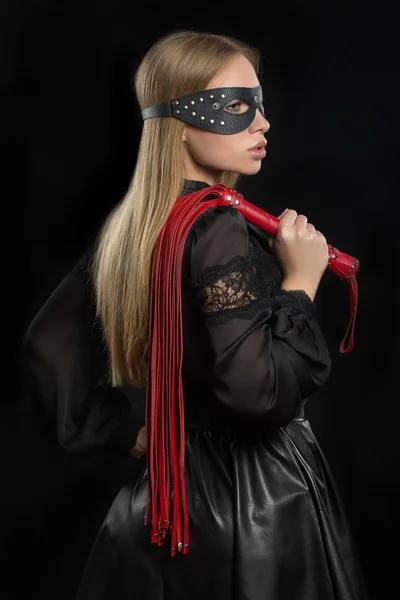 Girl with red leather whip and mask BDSM — Stock Photo, Image