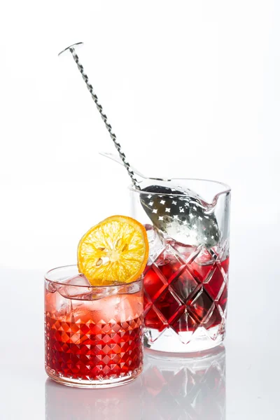 Amber cocktail in a glass isolated on white background — Stock Photo, Image