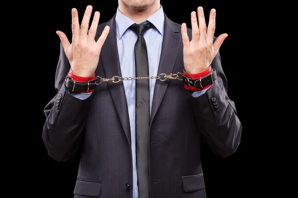 Man in a business suit with leather bound. handcuffs. sex Toys — Stock Photo, Image