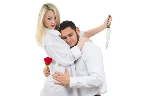 Ragazza con in mano un traditore. uomo con rosa in mano. sfondo bianco — Foto Stock