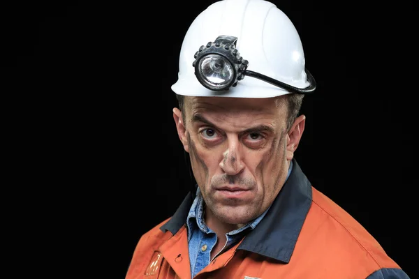 Coal miner showing lump of coal with thumbs up against a dark — Stock Photo, Image