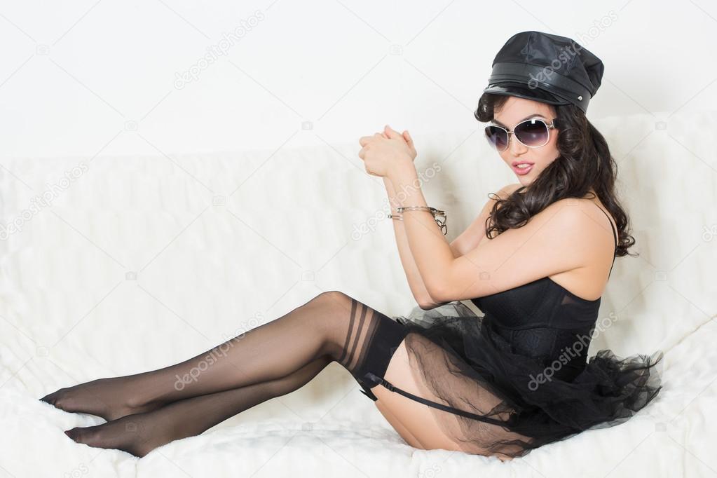 sexy woman with handcuffs in fashion glasses