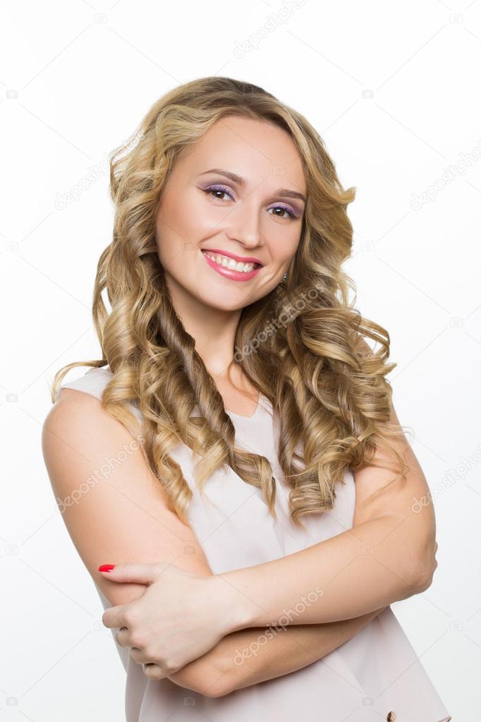 Beautiful woman with long blond curly hair.