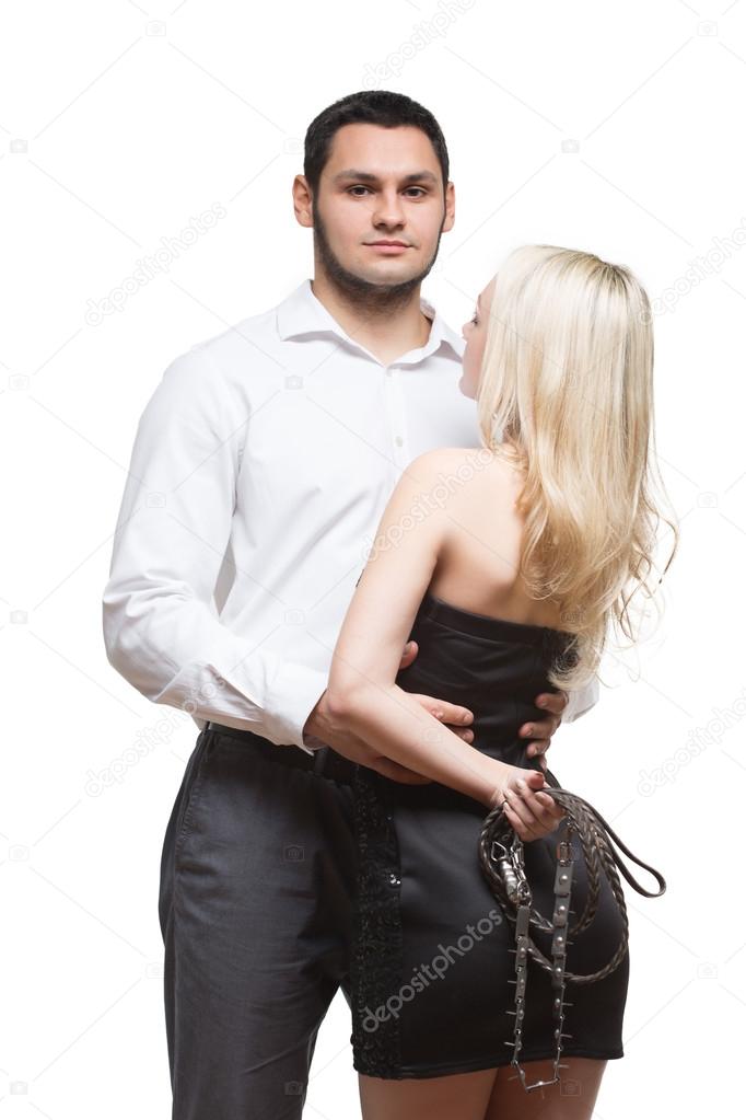 sexy couple. girl holding a leash. Isolated on white background