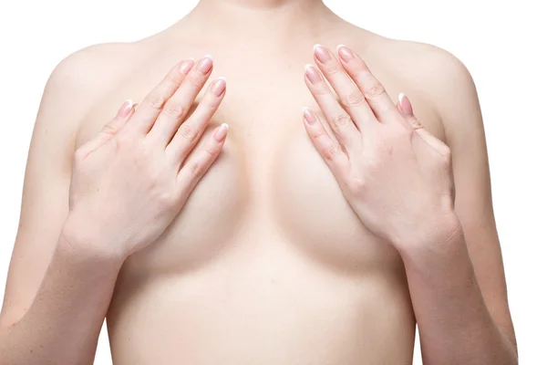 Göğüsler incelenmesi. Gömleksiz kadın göğüslerini süre inceleyerek close-up. İzole beyaz arka plan — Stok fotoğraf