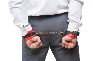 man with chained hands. handcuffs for sex games. isolated on white background