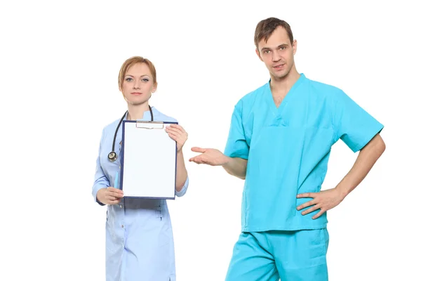 Group serious doctors presenting empty board. Isolated on white — Stock Photo, Image