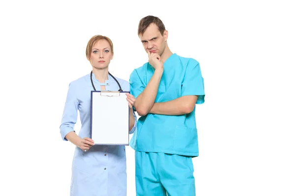 Group serious doctors presenting empty board. Isolated on white — Stock Photo, Image